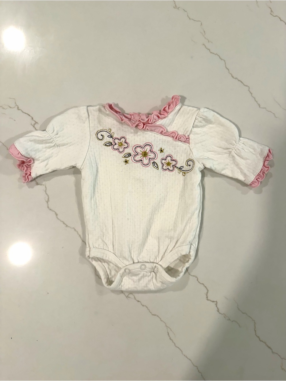 Embroidered Ruffle Onsie